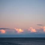cloudy sky over rippling sea